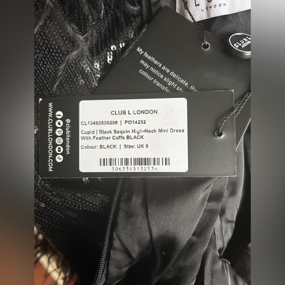 CUPID
BLACK SEQUIN HIGH-NECK MINI DRESS WITH FEATHER CUFFS - Picture 5 of 5